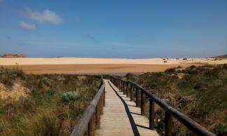 Boardwalk leading to a beach.